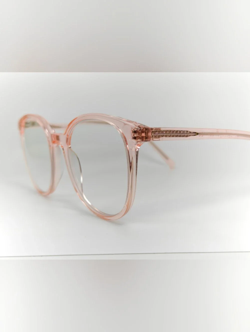 Noun. Transparent Pink Round Women's Eyeglasses. Minimalist..